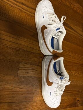 Nike White Sneakers with Brown Swoosh